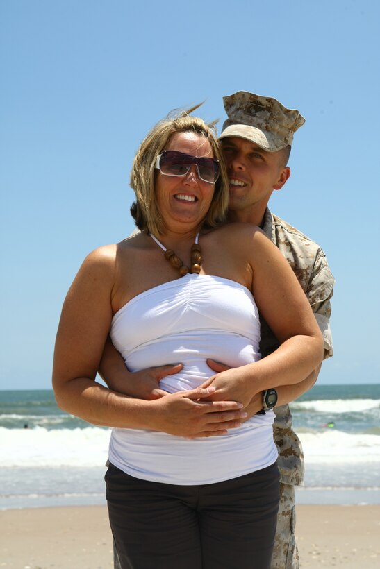 Gunnery Sgt. Michael Reiser and his wife Carri embrace aboard Onslow Beach July 10. The couple, who have been married 11 years and have two daughters, recently completed Camp Lejeune's Fireproof Marriage Enrichment Program.