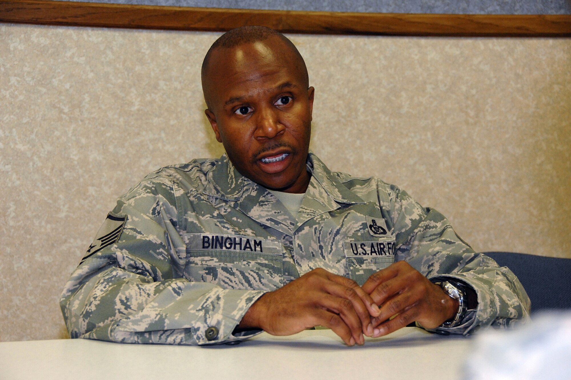 OFFUTT AIR FORCE BASE, Neb. -- Master Sgt. Tyrone F. Bingham, host aviation resource manager for the 170th Operational Support Squadron, explains how it feels to be selected as one of the Air Force's 12 Outstanding Airmen of the Year for 2009 in the 170th OSS conference room here July 9. Sergeant Bingham said he's shocked and honored to be selected as one of the Air Force's top Airmen. His numerous accomplishments over the past year include developing new aircrew in processing procedures, graduating from the Air Force Senior Non-Commissioned Officer Academy and achieving a physical fitness score of 94. U.S. Air Force Photo by Dana Heard