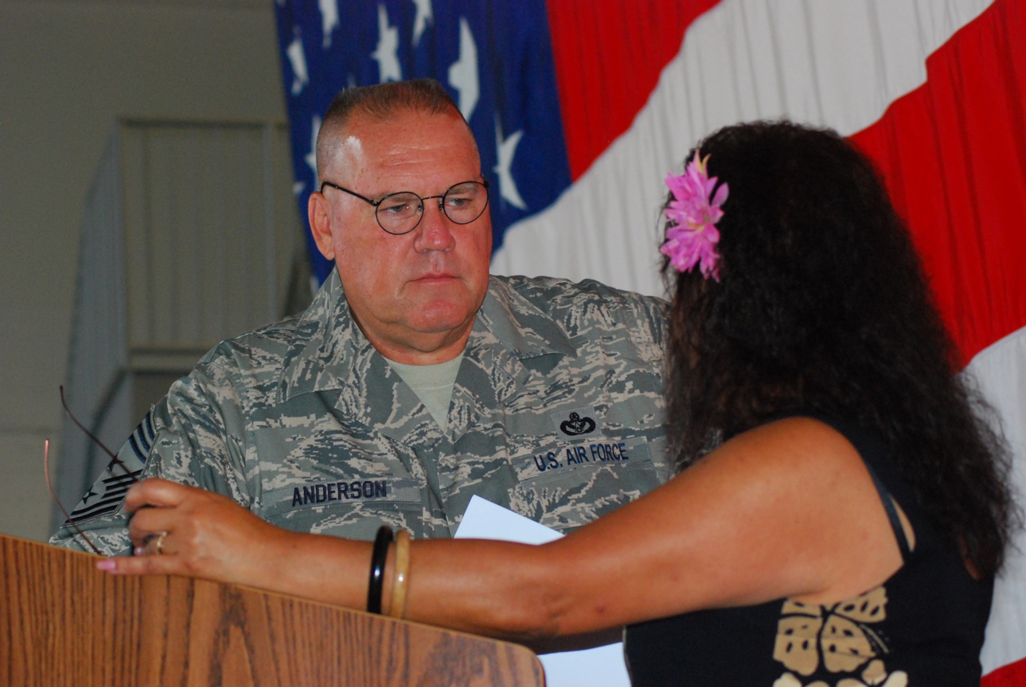 Chief Master Sgt. John Anderson, 94th Airlift Wing command chief, directs Tech. Sgt. Vanessa Miguel, 94th Civilian Personnel office, during a dry run for the Enlisted Commander's Call July 11.  The commander's call is mandatory for all enlisted ranks and takes place inside Bay 2 in building 838. Technical sergeants and below will report at 8 a.m. and Senior NCO's will report at 9:45 a.m.
