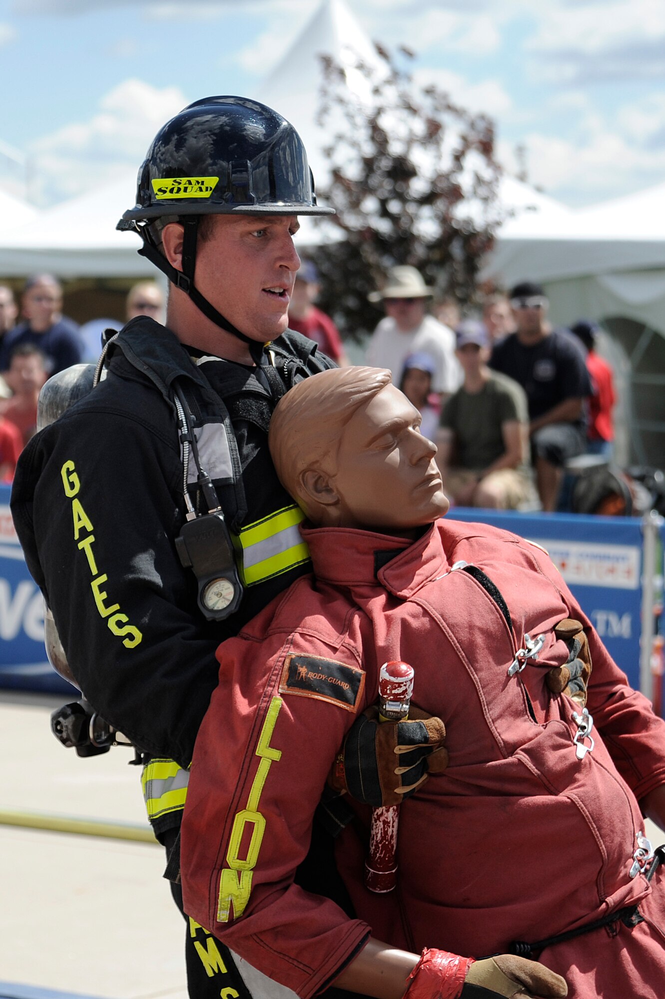 William Gates pulls a 175-pound dummy during the tandem to complete the competition.(U.S. Air Force Photo by Mike Kaplan)
