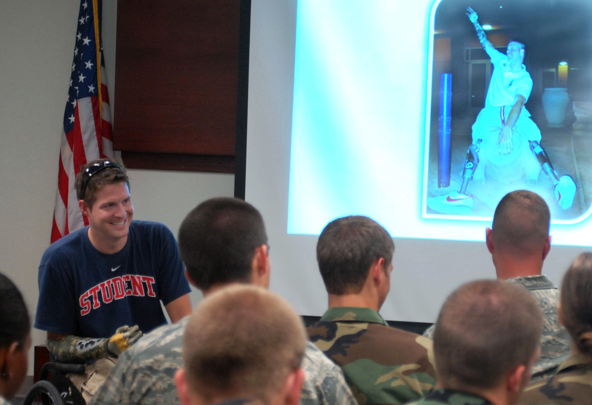 Brian Kolfage, Jr., former 17th Security Forces Squadron defender now retired Senior Airman, speaks to an audience which included 17th SFS defenders and Reserve Officer Training Corps cadets at Goofellow AFB, Texas on July 2.  Brian Kolfage spoke about his experience of coming under rocket attack in Iraq on Sept. 11, 2004, which left him without legs and a right arm.  (U.S. Air Force photo by Robert D. Martinez)