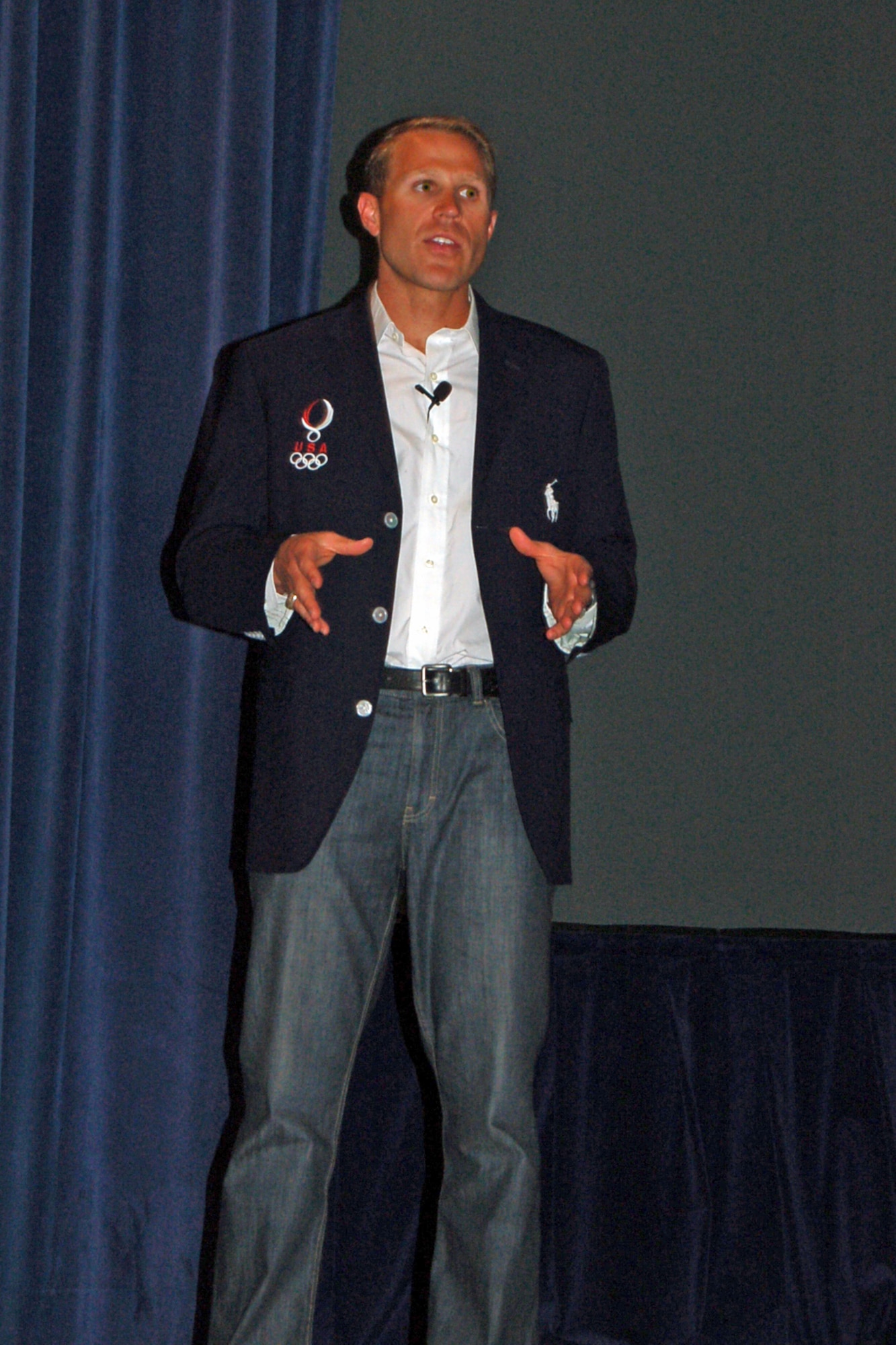 Eli Bremer, U.S. Olympic Team pentathlete, speaks to an audience gathered at the Peterson Air Force Base Auditorium June 22. His speech addressed the parallels related to sports and leadership during the Year of Leadership Fitness month. Half of the Olympians in the last four years are servicemembers, according to Mr. Bremer. (Air Force photo by Thea Skinner)