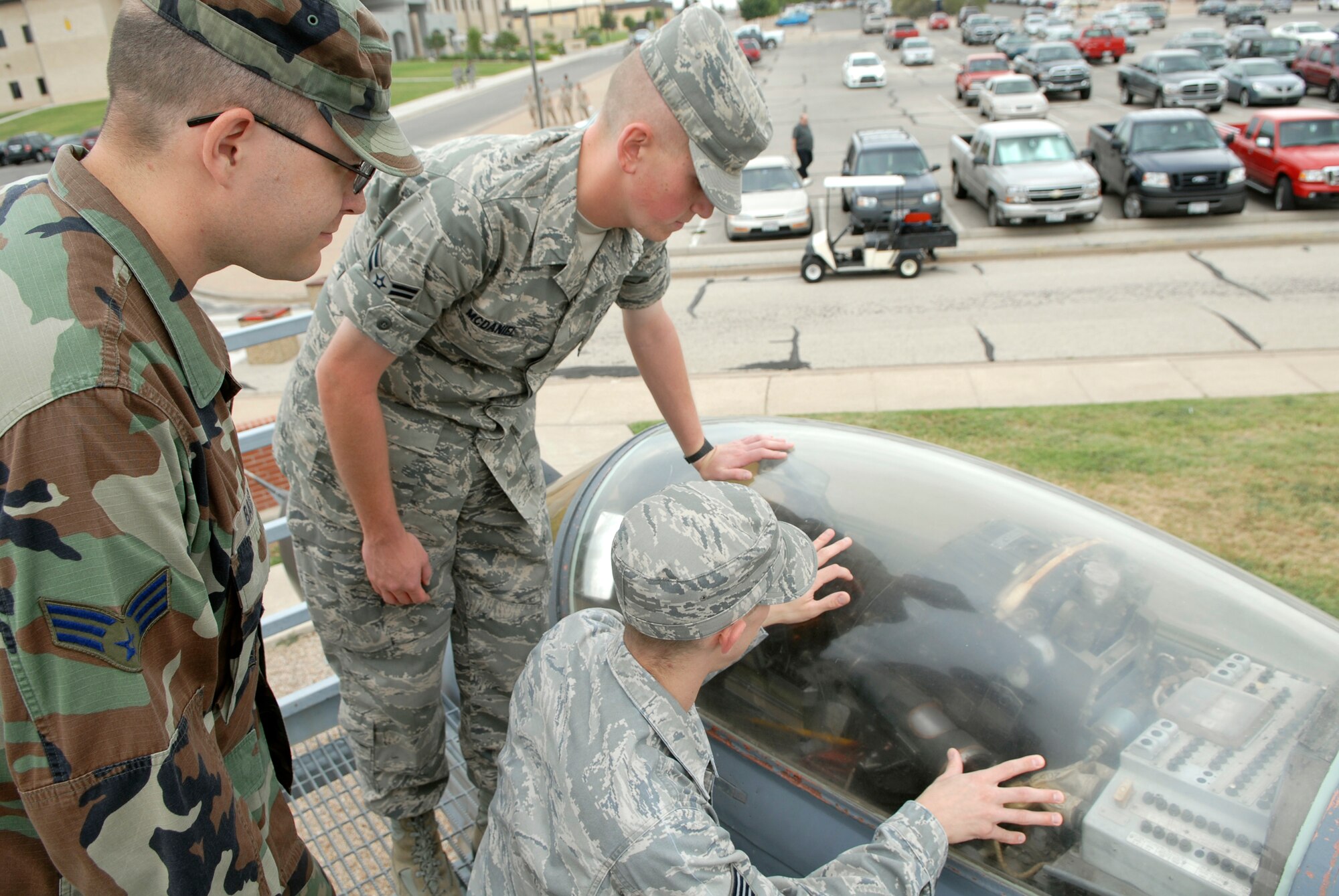 Staff Sgt. Nathan Shiffler, an instructor in the 315th Training Squadron points out features of the cockpit of the Soviet MiG-29 FULCRUM-A, ( U.S. Air Force photo by Lou Czarnecki) 