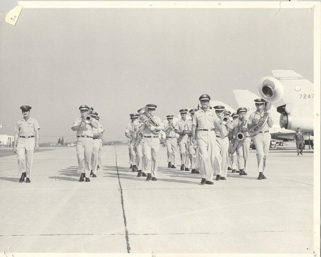 Otis ANGB, MA:  The Air National Guard Band of the Northeast, known in this photo as the 567th Air Force Band, marches past the 102FIW (now 102IW) F-106 flight line in this undated photo from the early 1970's.