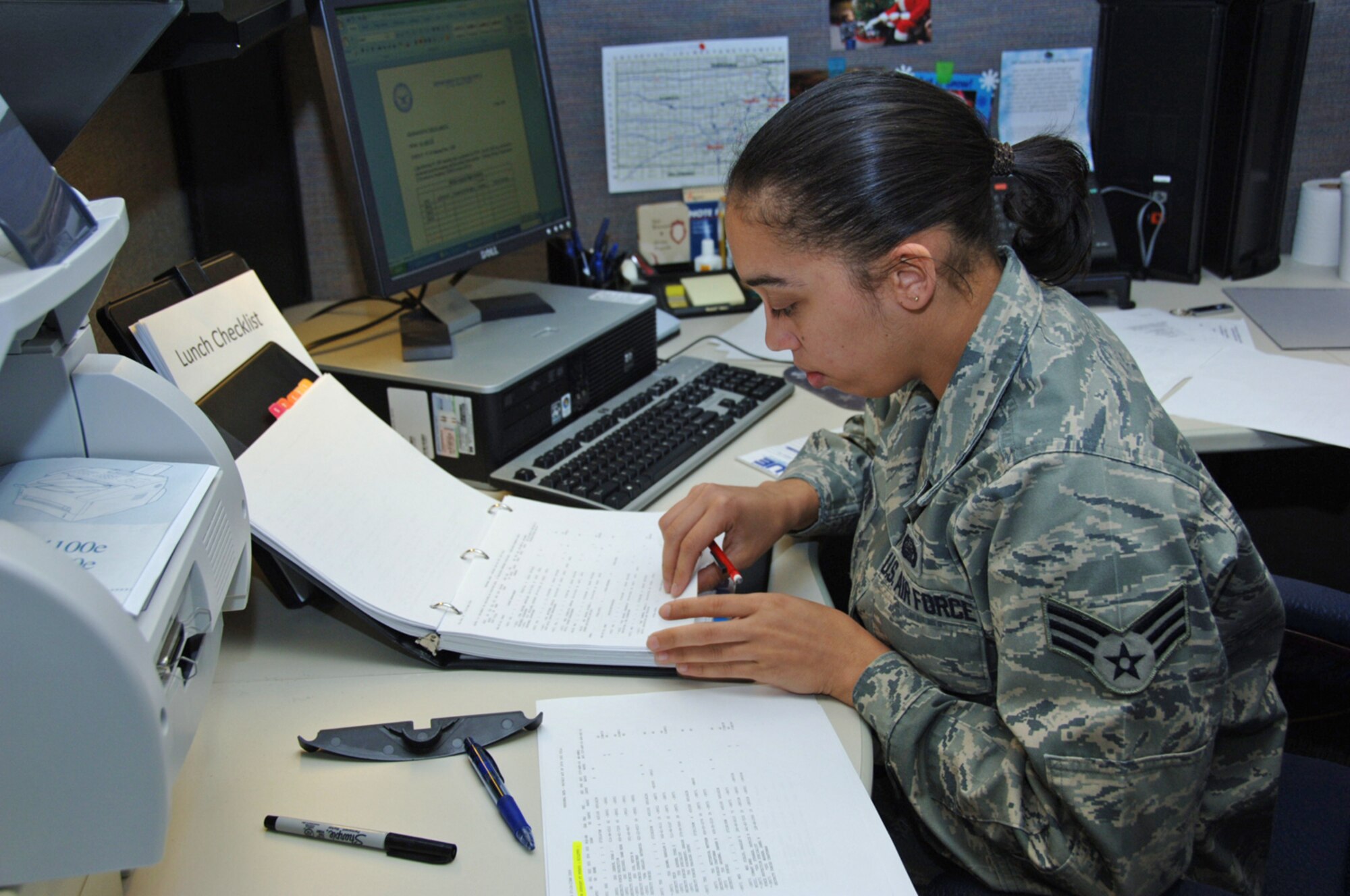 Senior Airman Angelique Ordoyne works at her desk during a 931st Air Refueling Group drill weekend at McConnell Air Force Base, Kan. Airman Angelique is a Reserve personnelist assigned to the 931st's Military Support Flight. (U.S. Air Force photo/Senior Airman Connor Burkhard)