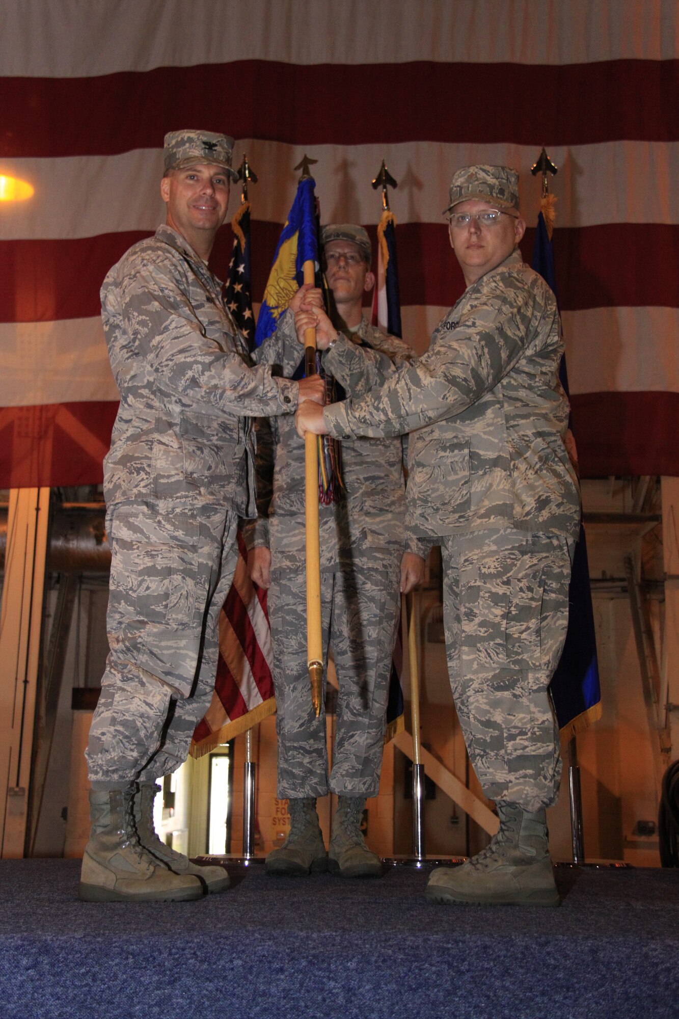Col. Marcus Novak, 48th Maintenance Group commander, passes the guidon to Maj. Darrin Dronoff as he takes command of the 48th Aircraft Maintenance Squadron at RAF Lakenheath, England, on June 30, 2009. (U.S. Air Force photo by Staff Sgt. Timothy Sanford)
