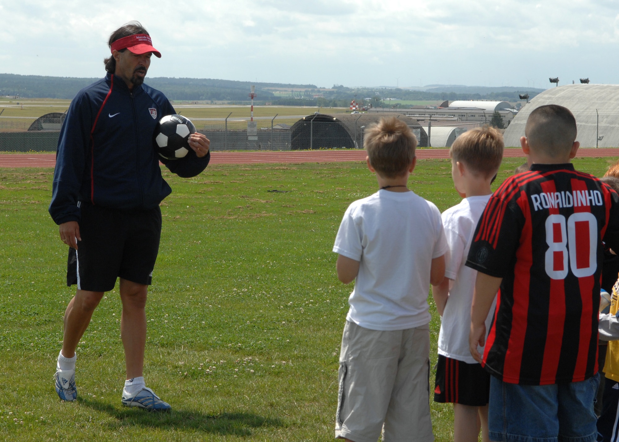SPANGDAHLEM AIR BASE, Germany – Marcelo Balboa, retired U.S. professional soccer player, answers questions from Spangdahlem youth before holding a soccer demonstration July 7 at the Skelton Memorial Fitness Center. Balboa retired in Colorado after a 13-year professional career. He was inducted into the U.S. Soccer Hall of Fame in 2005. (U.S. Air Force photo by Airman 1st Class Staci Miller)
