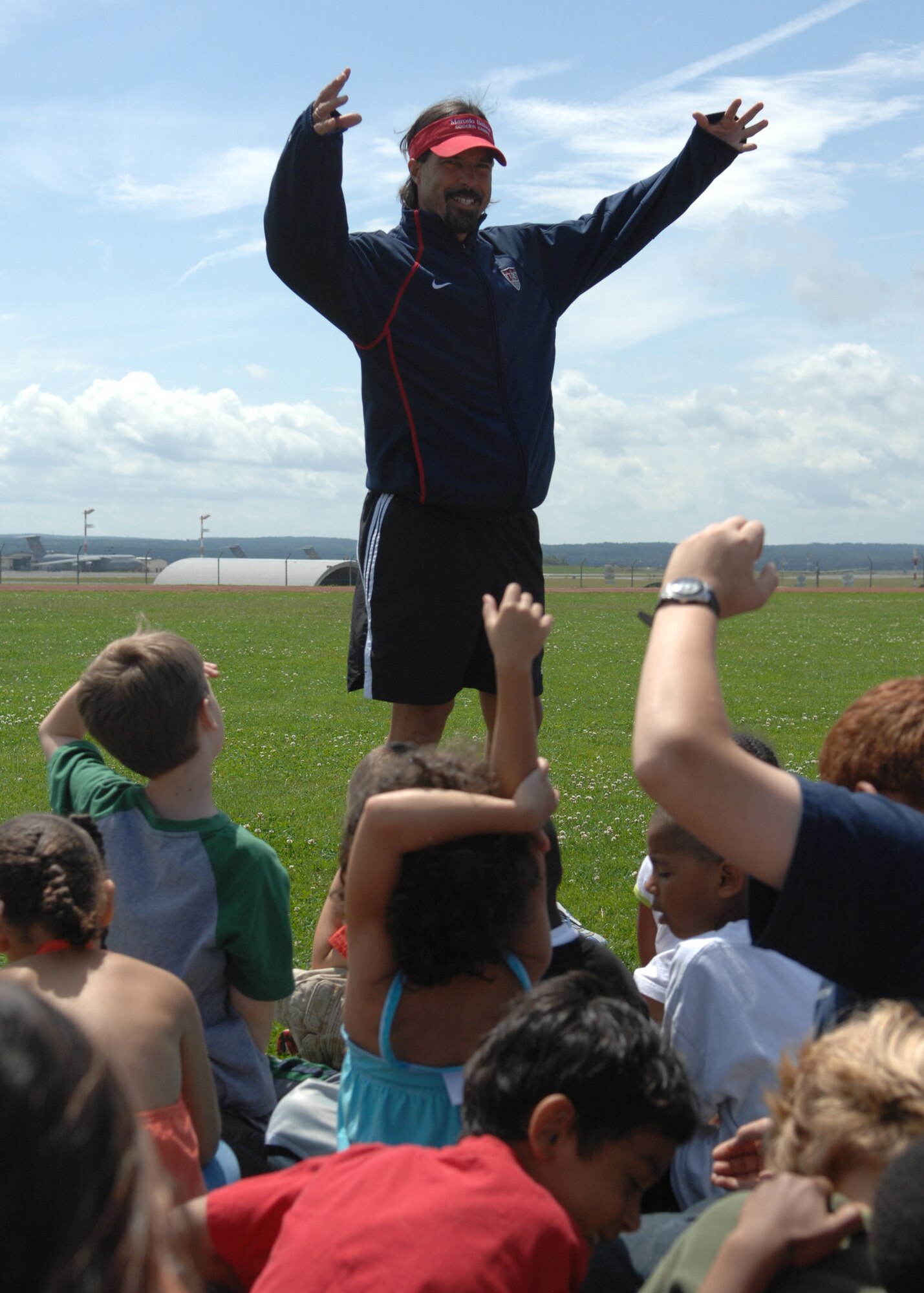 SPANGDAHLEM AIR BASE, Germany – Marcelo Balboa, retired U.S. professional soccer player, answers questions from Spangdahlem youth before holding a soccer demonstration July 7 at the Skelton Memorial Fitness Center. Balboa retired in Colorado after a 13-year professional career. He was inducted into the U.S. Soccer Hall of Fame in 2005. (U.S. Air Force photo by Airman 1st Class Staci Miller)