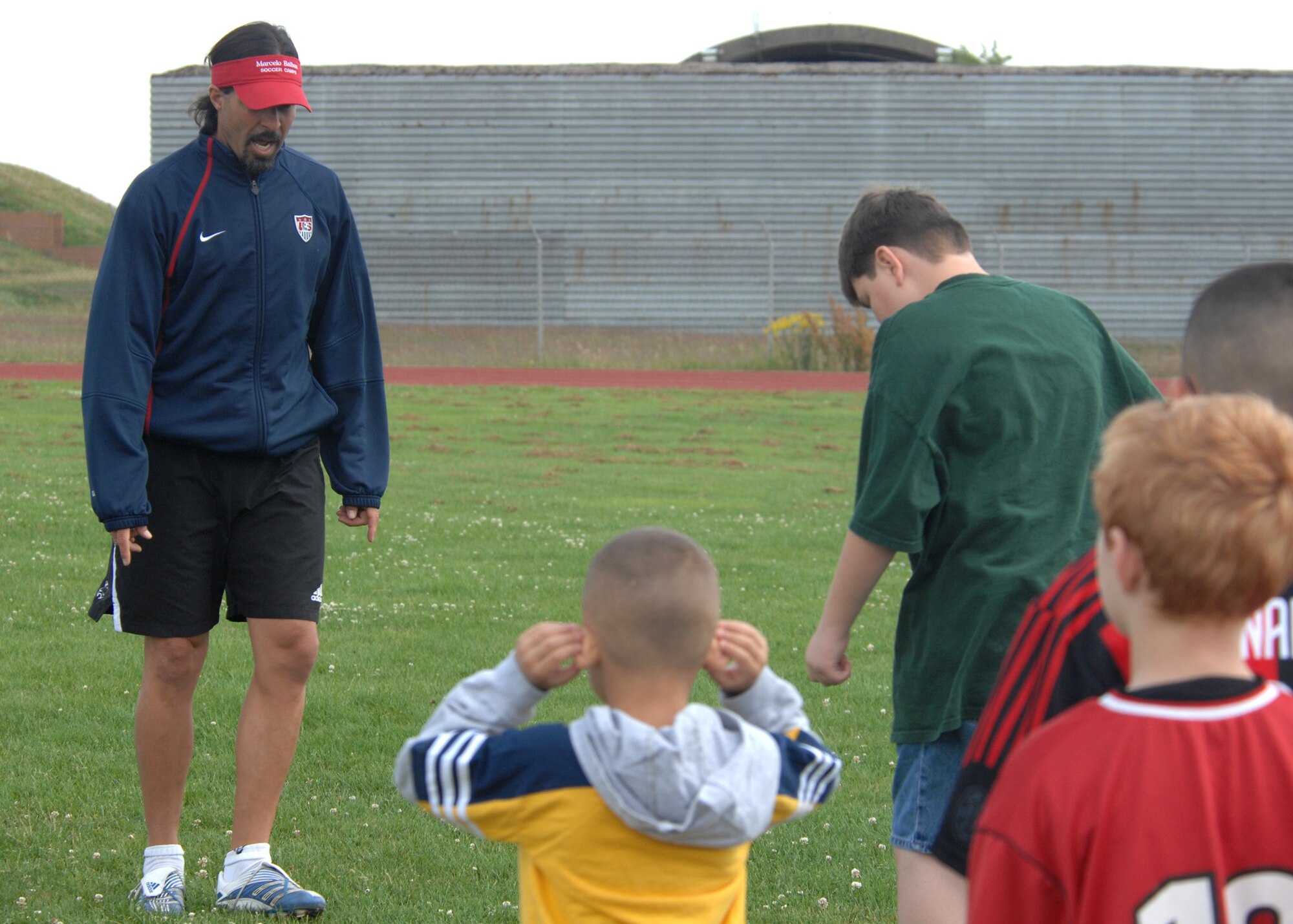 SPANGDAHLEM AIR BASE, Germany – Marcelo Balboa, retired U.S. professional soccer player, practices drills with Spangdahlem youth during a soccer demonstration July 7 at the Skelton Memorial Fitness Center. Balboa retired in Colorado after a 13-year professional career. He was inducted into the U.S. Soccer Hall of Fame in 2005. (U.S. Air Force photo by Airman 1st Class Staci Miller)