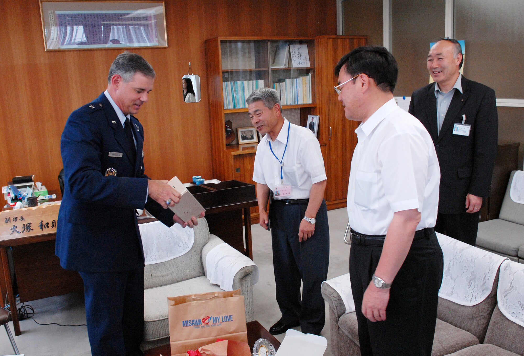 MISAWA AIR BASE, Japan -- Brig. Gen. Salvatore Angelella, 5th Air Force vice commander and 13th Air Force deputy commander  along with Col. David Stilwell, 35th Fighter Wing commander, visit with Mr. Kazunori Otsuka, Misawa City vice mayor July 10 at Misawa City Hall. General Angelella was in town visiting with city leaders and Japanese Self-defense Force Leadership. (Air Force photo/Staff Sgt. Phillip Butterfield)