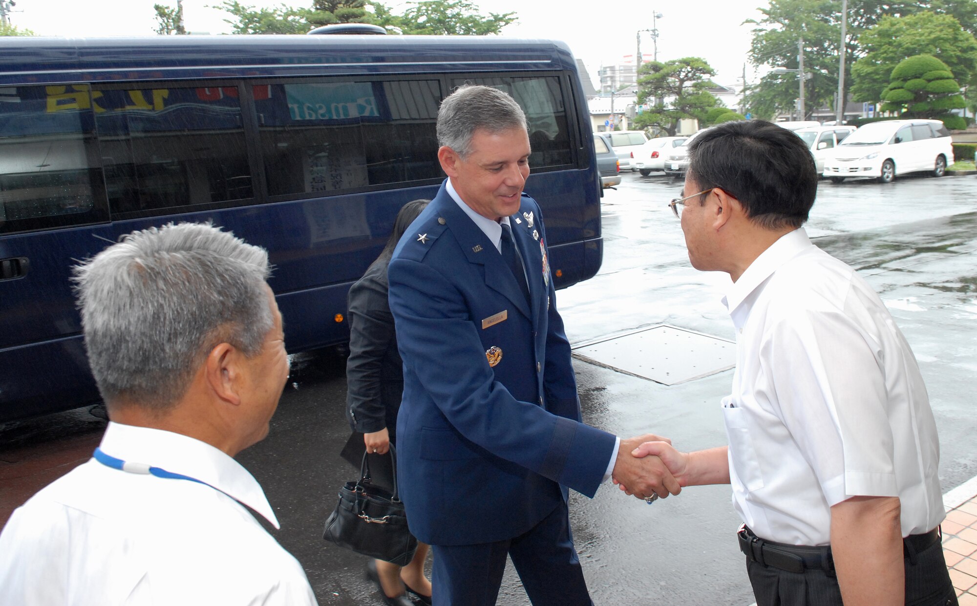 MISAWA AIR BASE, Japan -- Brig. Gen. Salvatore Angelella, 5th Air Force vice commander and 13th Air Force deputy commander  along with Col. David Stilwell, 35th Fighter Wing commander, visit with Mr. Kazunori Otsuka, Misawa City vice mayor July 10 at Misawa City Hall. General Angelella was in town visiting with city leaders and Japanese Self-defense Force Leadership. (Air Force photo/Staff Sgt. Phillip Butterfield)