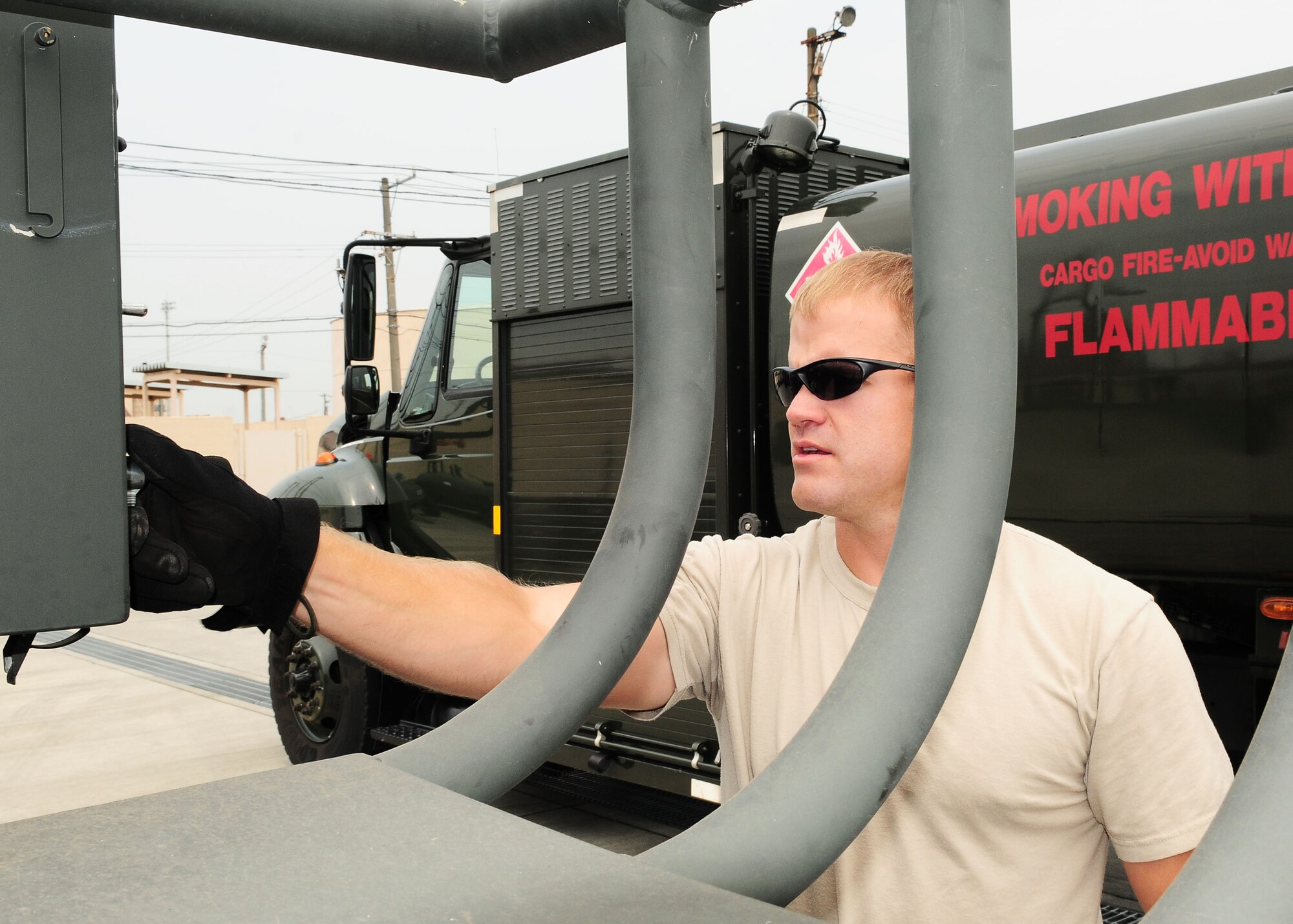 YOKOTA AIR BASE, Japan – Staff Sgt. Shane Frakes, 374th Logistics Readiness Squadron Fuels Management Flight, turns on an R-14, a piece of fuels mobility support equipment, recently. Airmen use the R-14 to pump fuel from a fuel bladder or tank to another source such as an aircraft or a fuel truck. (U.S. Air Force photo/Airman 1st Class Michael Dillon)