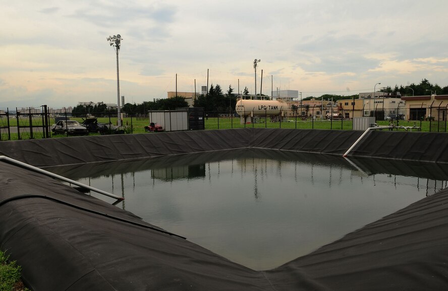 Yokota AIR BASE, Japan -- A fire training facility pond holds Japan native Medaka
Fish. An active mosquito surveillance and control program was implemented in
2007 on Yokota Air Base to reduce and control mosquitoes. One measure introduced was a biological mosquito control program initiated by the 374th Civil Engineer Squadron Entomology section and the Installation Natural Resources Program Manager, Mr.Yoshitaka Yamaguchi. Medaka, also known as Japanese killifish, and Oryzias latipes are common throughout Asia and are mosquito-larvivorous, which means larvae eating fish. (U.S. Air Force photo/Airman 1st Class Devin Doskey) 
