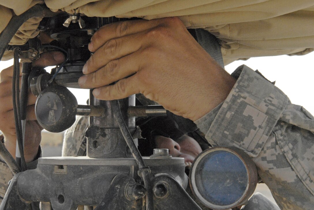 Army Pfc. Dustin Clark adjusts the sights on a radar system at Contingency Operating Base Basra, Iraq, June 28, 2009. Clark and other members of Echo Battery, 4th Battalion, 5th Air Defense Artillery Regiment, out of Fort Hood, Texas, detect mortar and rocket attacks. U.S. Army photo by Pfc. J. Princeville Lawrence
