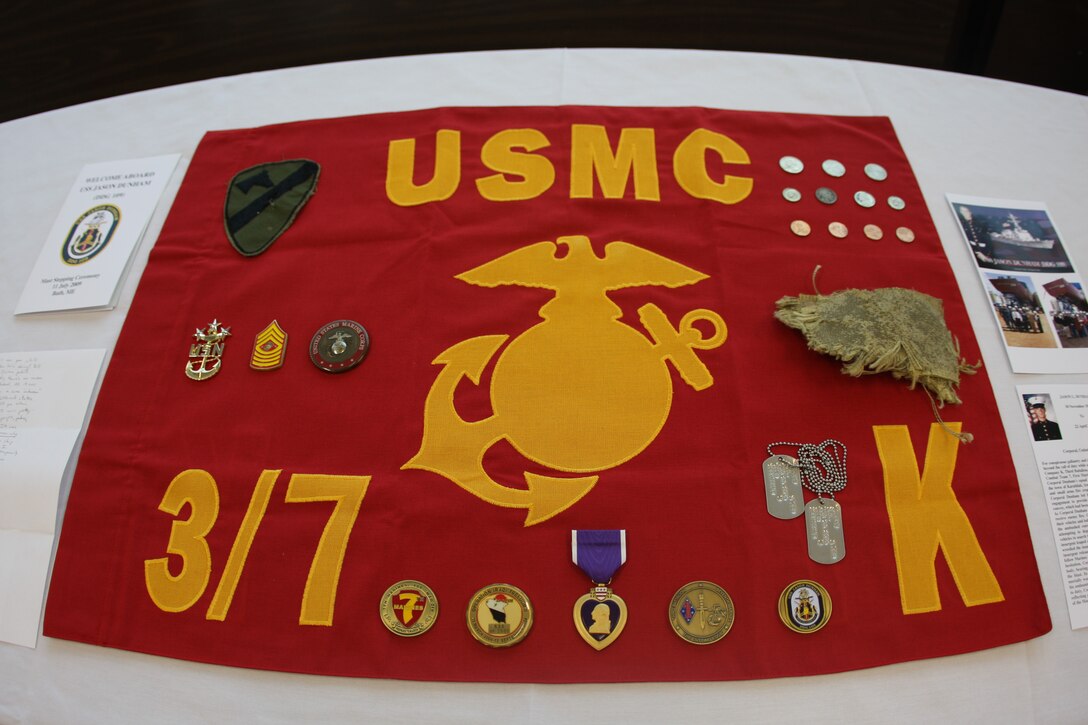 The items forever stored in the mast of the guided missile destroyer the USS Jason Dunham include Cpl. Jason Dunham’s Purple Heart, a set of his dog tags, a piece of the Kevlar helmet he used to absorb the blast from a grenade in Karabilah, Iraq, April 14, 2004, and the last letter he sent home to his parents Dan and Deb Dunham. Dunham’s actions earned him the Medal of Honor and a place in Marine Corps history.