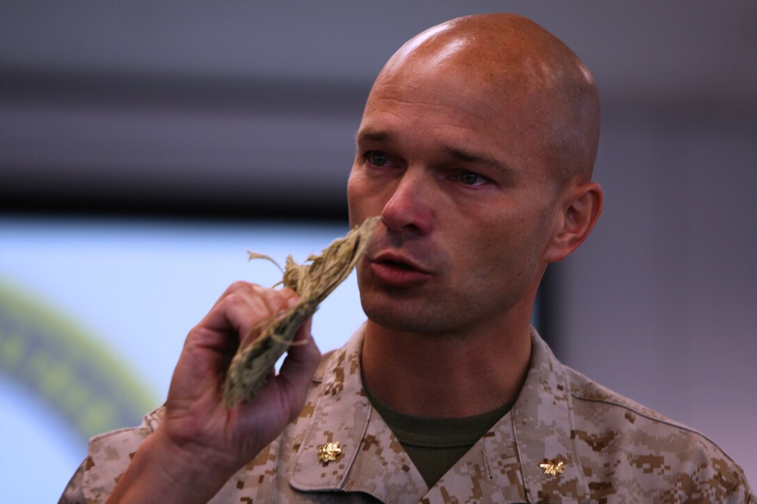 Maj. Trent A. Gibson, the former company commander of Medal of Honor recipient Cpl. Jason Dunham, speaks to the crew of the USS Jason Dunham while holding a piece of the helmet Dunham used to save the lives of his fellow Marines. It was later sealed in the mast of the destroyer bearing his name during the mast stepping ceremony held July 11.