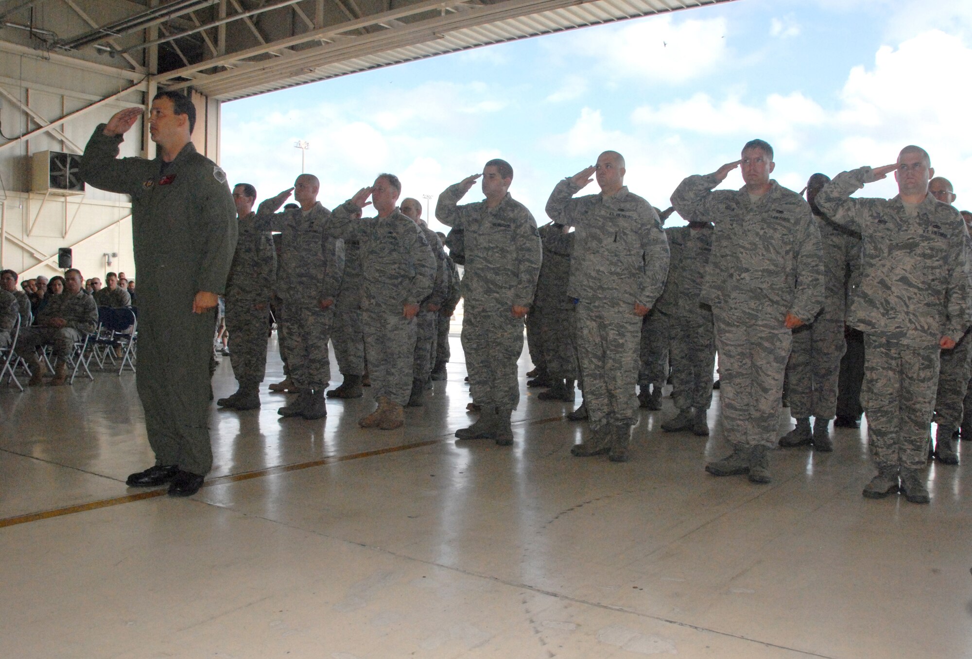 Lt. Col. Stuart Moore, 76th Fighter Squadron director of operations, leads the assembled, newly-activated 476th Fighter Group in a salute to the Group's commander Col. Greg Eckfeld during an activation ceremony at Moody Air Force Base, Ga., July 11, 2009.  The 476th FG, an Air Force Reserve Command A-10 Thunderbolt II unit here, will fly the 23rd Wing's -- Moody's host unit -- A-10s in a partnership with the Regular Air Force. (U.S. Air Force photo/Master Sgt. Bill Huntington)