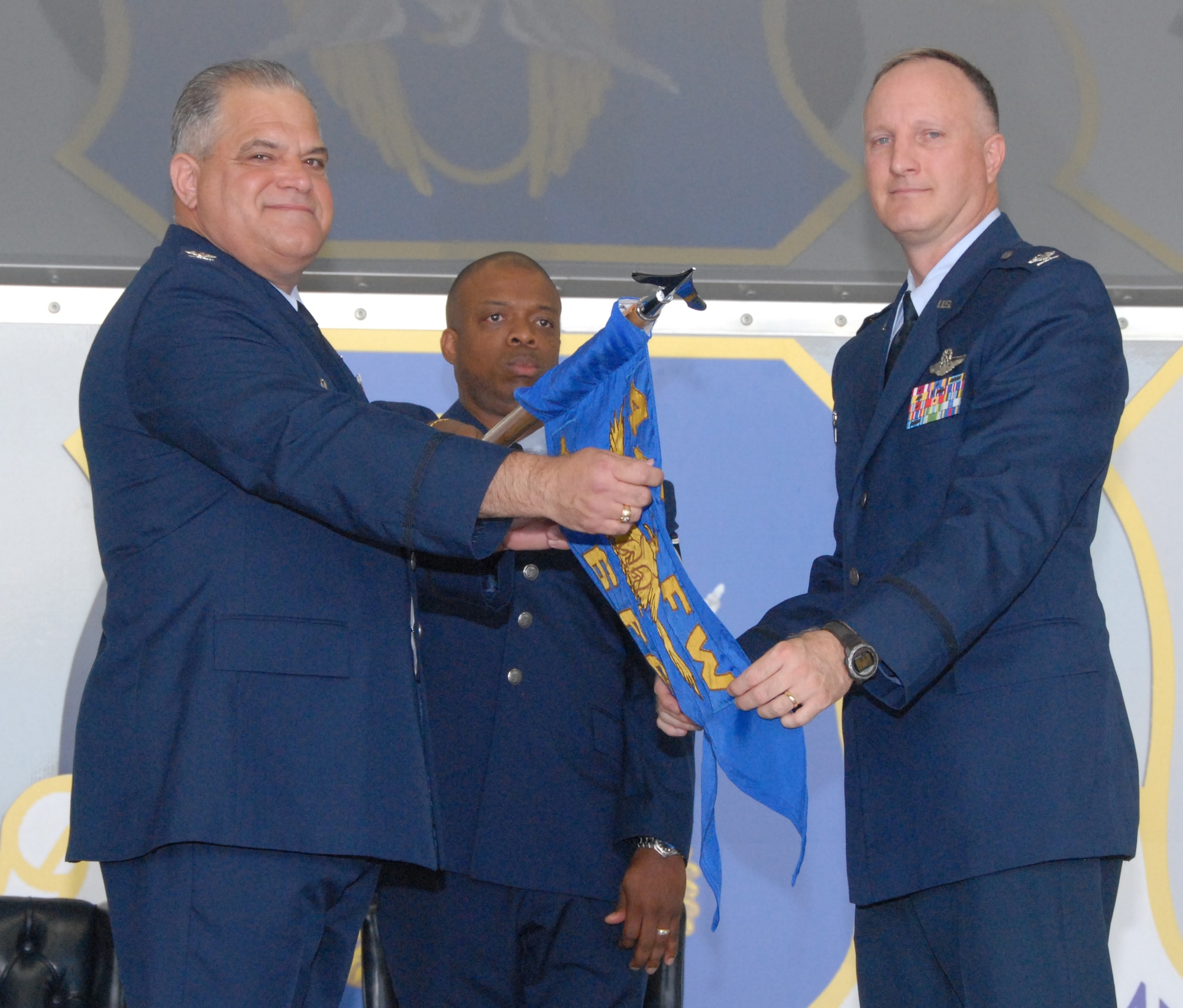 Col. Mark Clemons, 442nd Fighter Wing commander, and Col. Greg Eckfeld, 476th Fighter Group commander, reveal the newly-activated 476th FG's guidon flag in a special activation ceremony at Moody Air Force Base, Ga., July 11, 2009. The 476th FG, an Air Force Reserve Command A-10 Thunderbolt II unit will fly the 23rd Wing's -- Moody's host unit -- A-10s in a partnership with the Regular Air Force.  The 442nd FW, based at Whiteman AFB, Mo., is the 476th FG's parent unit. (U.S. Air Force photo/Master Sgt. Bill Huntington)