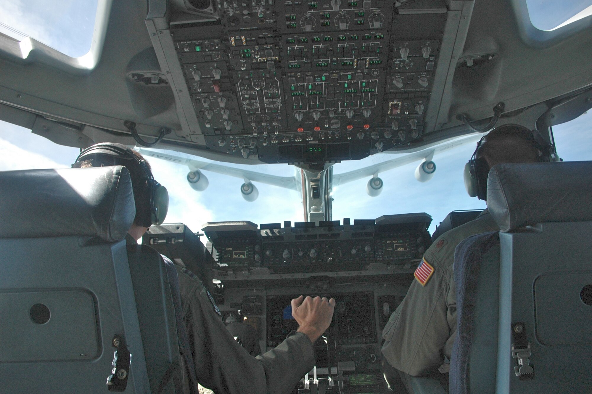 Capt. Shayne Mathews and Maj. Mark Klarich, 512th Airlift Wing, Dover Air Force Base, Del.,perform an air refueling while on a C-17 training mission July 9. Major Klarich will be evaluated on an air refueling operation during the Air Mobility Command Rodeo July 19-24 at McChord AFB, Wash. (U.S. Air Force Photo/2nd Lt Joe Simms)