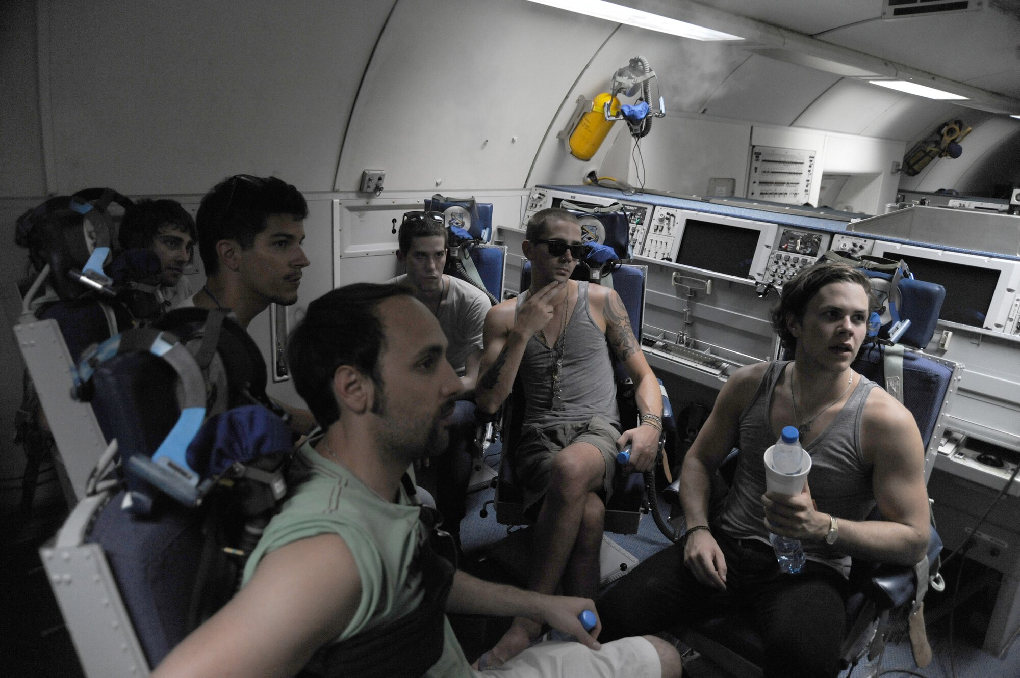 SOUTHWEST ASIA - Members of the band "Elevation" are briefed on the airborne warning and control systems (AWACS) mission aboard an E-3 Sentry at the 380th Air Expeditionary Wing, July 10 in Southwest Asia. The band was able to tour the 380th AEW and learn about the wing's mission before their performance. The band performed at several locations throughout Southwest Asia as part of an Armed Forces Entertainment tour. (U.S. Air Force photo by Senior Airman Brian J. Ellis)