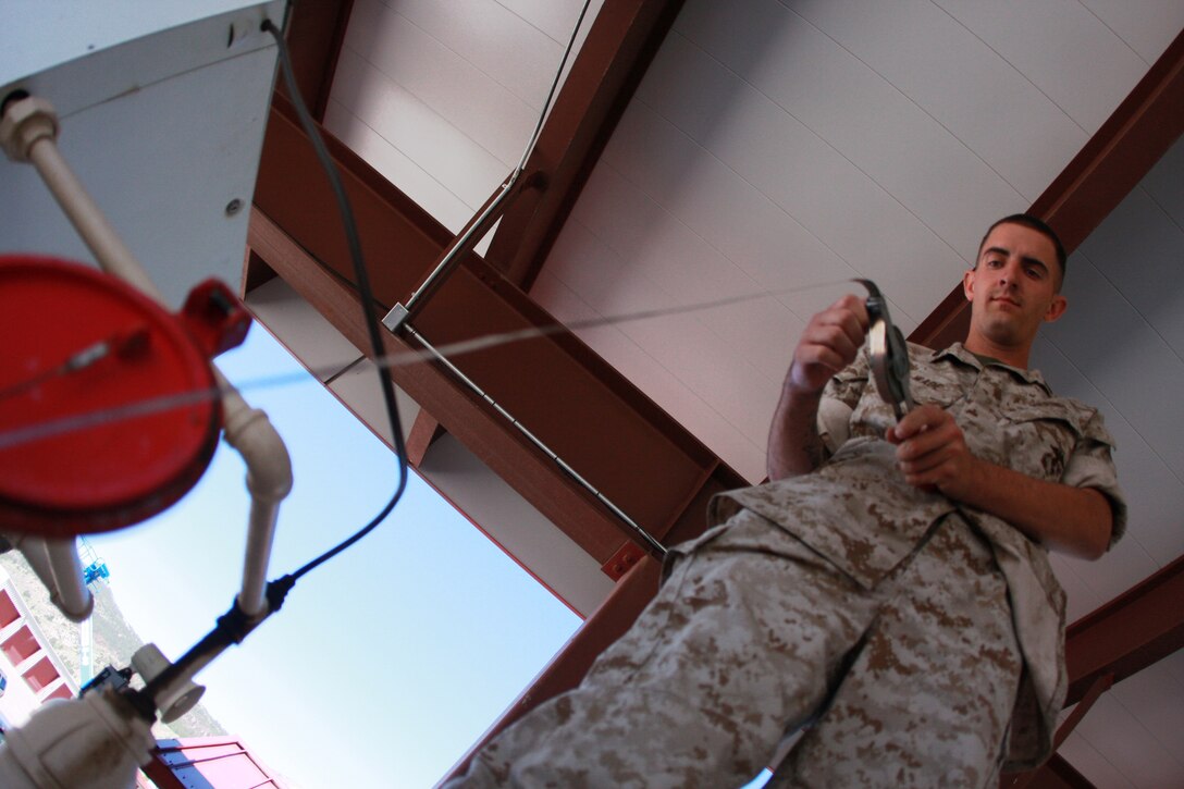 Sgt. Mark D. Wade checks tests the fuel aboard Mountain Warfare Training Center Bridgeport, Calif., July 14 before opening the fuel station. Wade, an Ocean City, Md., native is stationed at MWTC, and is the only bulk fuel specialist aboard the base.