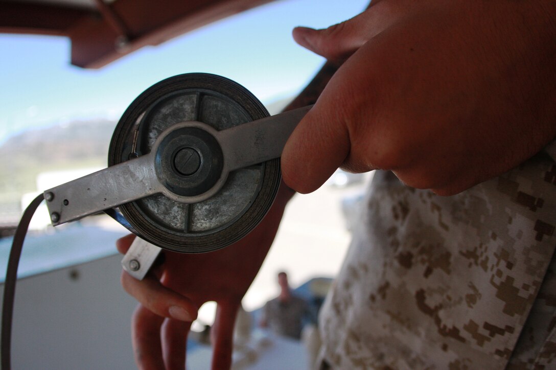 Sgt. Mark D. Wade checks tests the fuel aboard Mountain Warfare Training Center Bridgeport, Calif., July 14 before opening the fuel station. Wade, an Ocean City, Md., native, is stationed at MWTC, and is the only bulk fuel specialist aboard the base.
