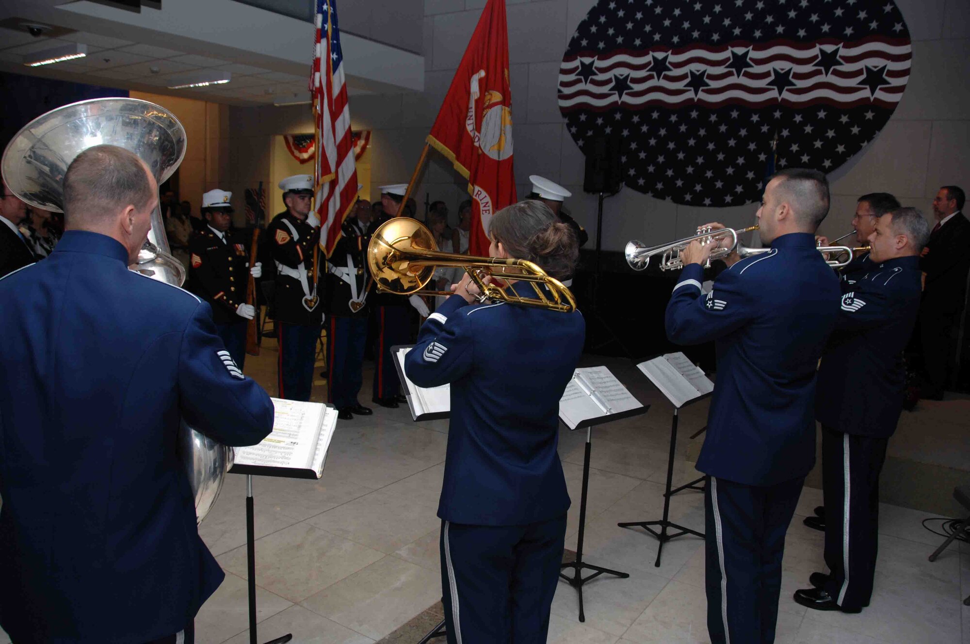 CORINTO, Nicaragua -- The Air Forces Southern Band's
brass quintet plays the National Anthem while the Marine Corps color
guard presents the colors during an Independence Day concert at the U.S.
Embassy in Managua, Nicaragua, July 5. The band is in Nicaragua with the
Military Sealift Command hospital ship USNS Comfort (T-AH 20) in support
of Continuing Promise 2009, a four month humanitarian and civic
assistance mission to Latin America and the Caribbean region. (U.S. Navy
photo by Mass Communication Specialist 2nd Class Marcus Suorez)