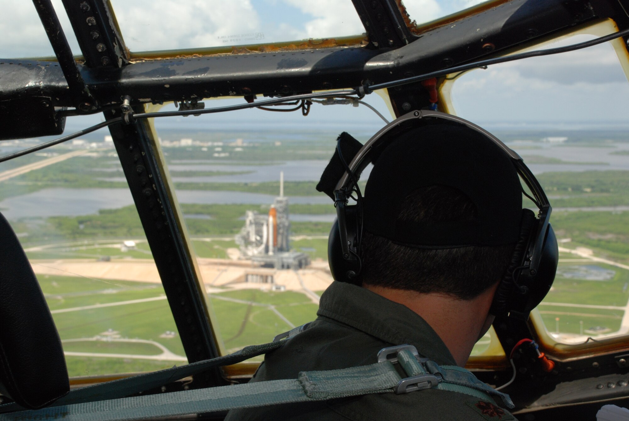 PATRICK AIR FORCE BASE, Fla. - Citizen Airmen from the 920th Rescue Wing here shuttle their civilian bosses over Cape Canaveral past Space Shuttle Endeavor prior to launch in an HC-130P/N Hercules aircraft.  The Airmen who play a vital role in space launches, share a day showcasing heroes and hardware of the unit to help the employer's understand their role in the nation's defense. (U.S. Air Force Photo/Master Sgt. Bryan Ripple)