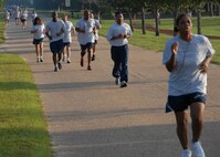 Members of the 919th Special Operations Wing participate in the 1.5 mile run as part of their annual physical fitness test July 12 during the UTA weekend at Duke Field.  Squadrons began early at 7 a.m. for the testing.  New Air Force guidance on PT testing was released in June to take effect in 2010.  Some of the new changes include bi-annual testing and more points awarded to the run time.  (U.S. Air Force photo/Staff Sgt. Samuel King Jr.)