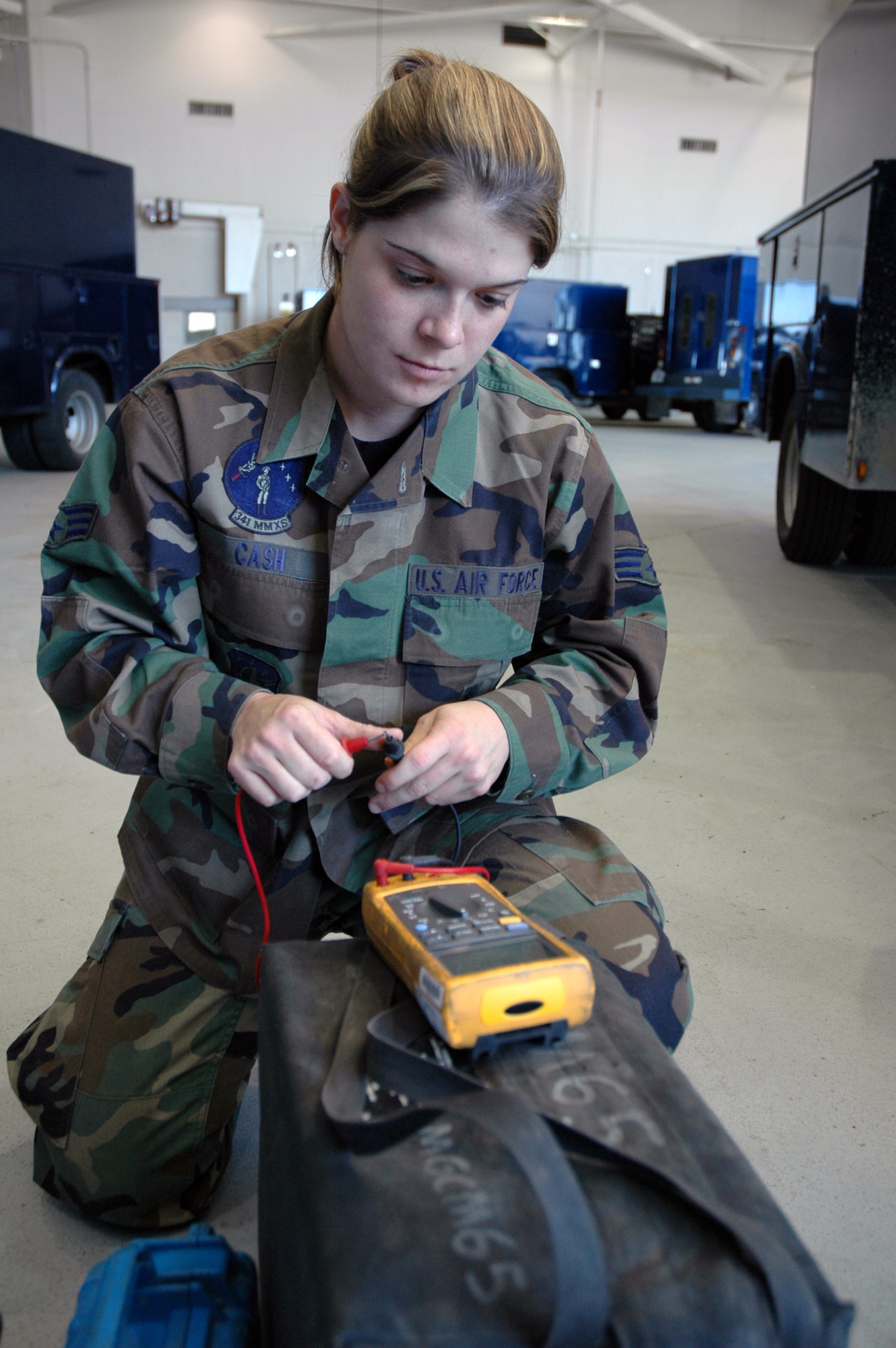 Senior Airman Nicoletta Cash, 341st Missile Maintenance Squadron electromechanical team member, checks a multimeter for functionality before posting to the missile field July 3. Airman Cash posted to the field during the last code change in the 10th Missile Squadron. (U.S. Air Force photo/Senior Airman Dillon White)