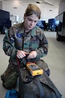 Senior Airman Nicoletta Cash, 341st Missile Maintenance Squadron electromechanical team member, checks a multimeter for functionality before posting to the missile field July 3. Airman Cash posted to the field during the last code change in the 10th Missile Squadron. (U.S. Air Force photo/Senior Airman Dillon White)