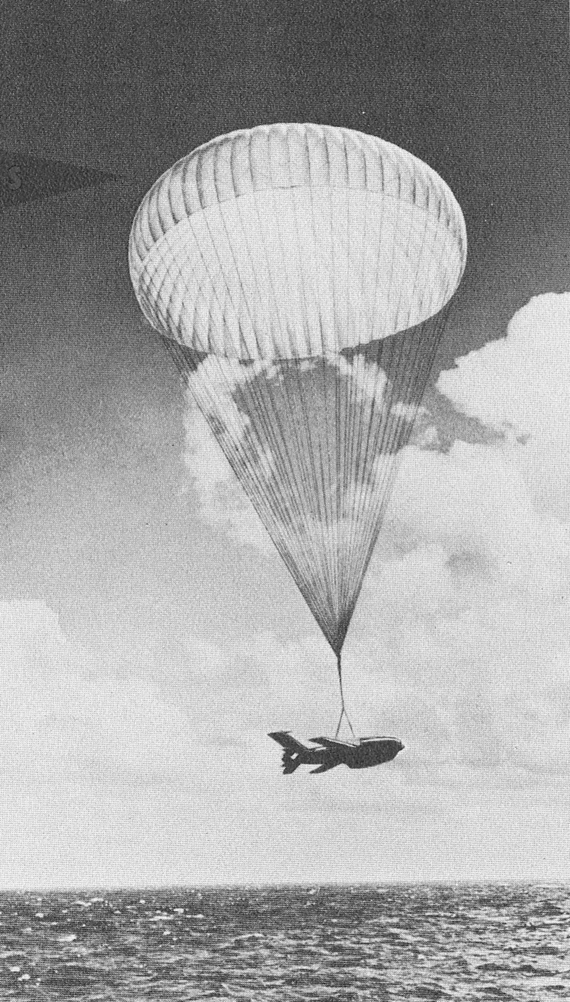 After a flight, an 81-foot diameter parachute brings the Firebee to splashdown. (Photo courtesy the New Mexico Museum of Space History archives/Ryan Aeronautical Company)