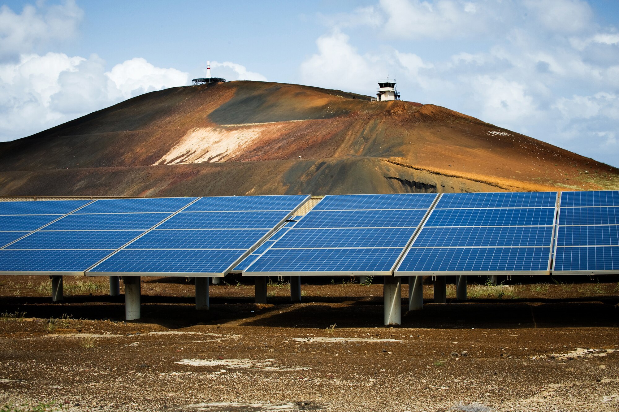Several rows of solar panels provide power for the runway lights at Ascension Auxiliary Airfield, a small base belonging to the 45th Space Wing. The base, located on Ascension Island in the South Atlantic Ocean, has earned several awards for its energy conservation initiatives. (U.S. Air Force photo/Lance Cheung)