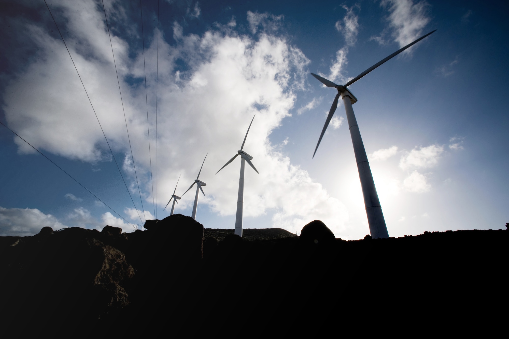 Four 225-kilowatt wind turbines help produce power for Ascension Auxiliary Airfield, a small base belonging to the 45th Space Wing. The base is located on the British-owned island of Ascension, which is positioned in the South Atlantic Ocean several thousand miles from the coast of Africa. (U.S. Air Force photo/Lance Cheung)
