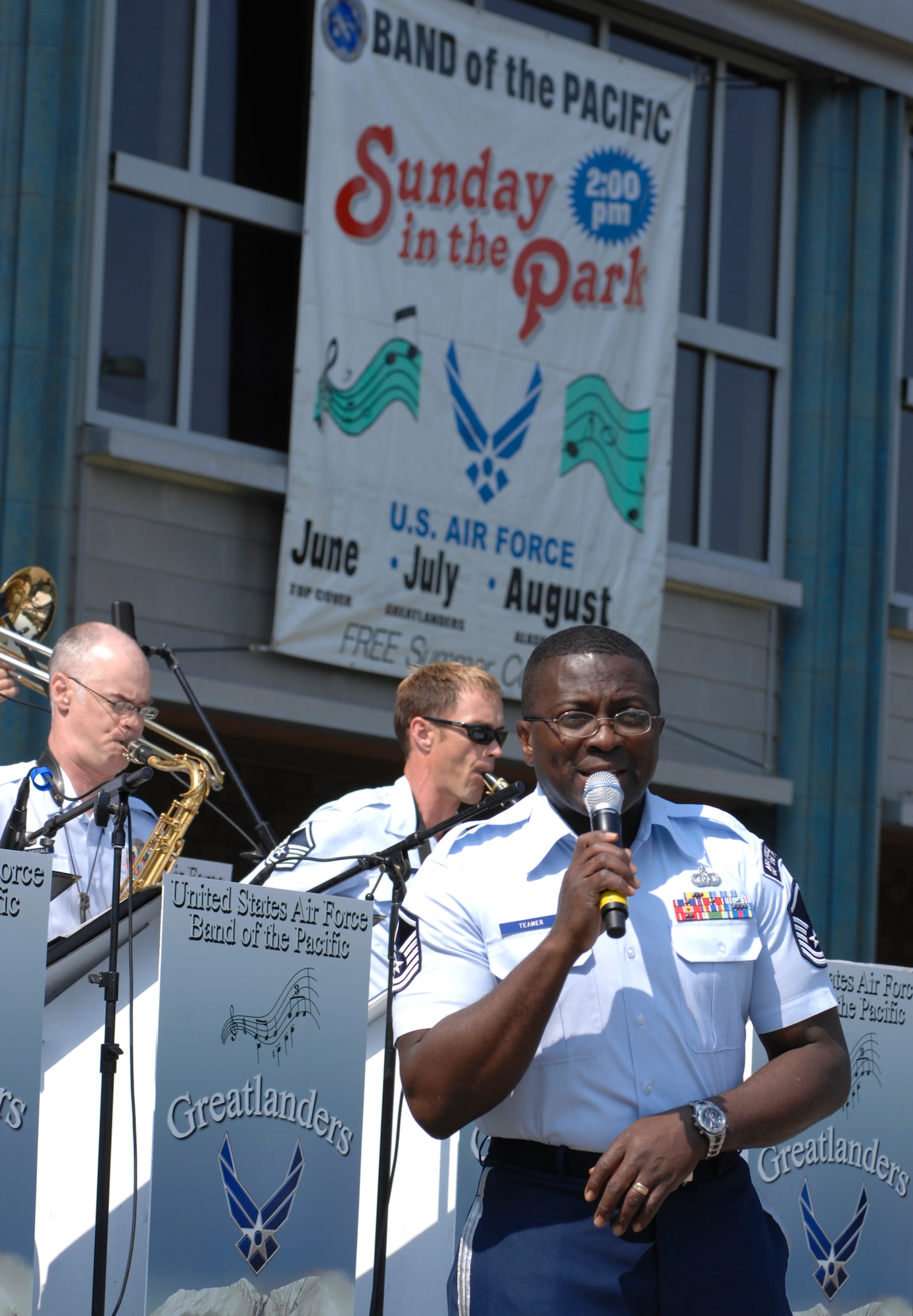 ANCHORAGE, Alaska -- Master Sgt. John Teamer talks to the crowd during the opening performances of the Sunday in the Park concert in Anchorage's Town Square July 12. Teamer is a member of the U.S. Air Force Band of the Pacific's Greatlanders. (U.S. Air Force photo/Senior Airman David Carbajal)