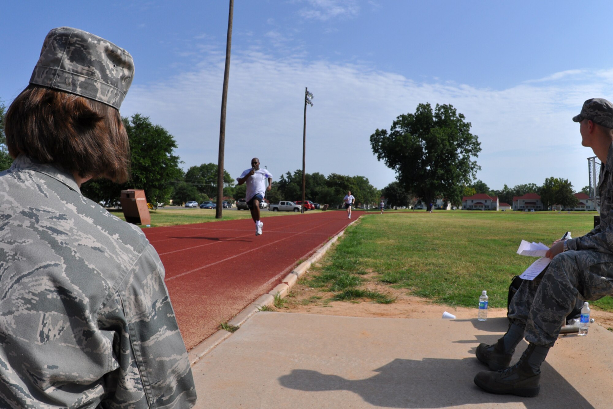 Staff Sgt. Kirk Williams, 917th Communications Flight, communications system operator, gains his second wind to push out the last hundred yards with a sprint during his annual fitness test at Barksdale Air Force Base, La., July 12, 2009. The Air Force Fitness Test is designed to test the body composition, muscular strength/endurance and cardiovascular respiratory fitness of Airmen in the U.S. Air Force. As part of the “Fit to Fight” program, the Air Force adopted a more stringent physical fitness assessment; the new fitness program was established on January 1, 2004, and replaces the annual ergo-cycle test that Air Force used before. (U.S. Air Force photo/Tech. Sgt. Jeff Walston)