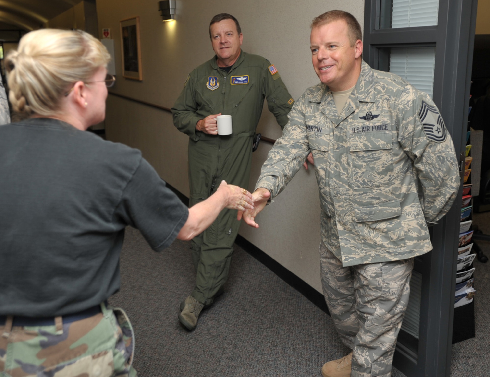 Chief Master Sgt. Sean Martin is introduced to Senior Master Sgt. Pam Summers at the headquarters of the 931st Air Refueling Group. Chief Martin is the 931st's new command chief. Sergeant Summers is in charge of the Group's Education and Training Office. (U.S. Air Force photo/Tech. Sgt. Jason Schaap)