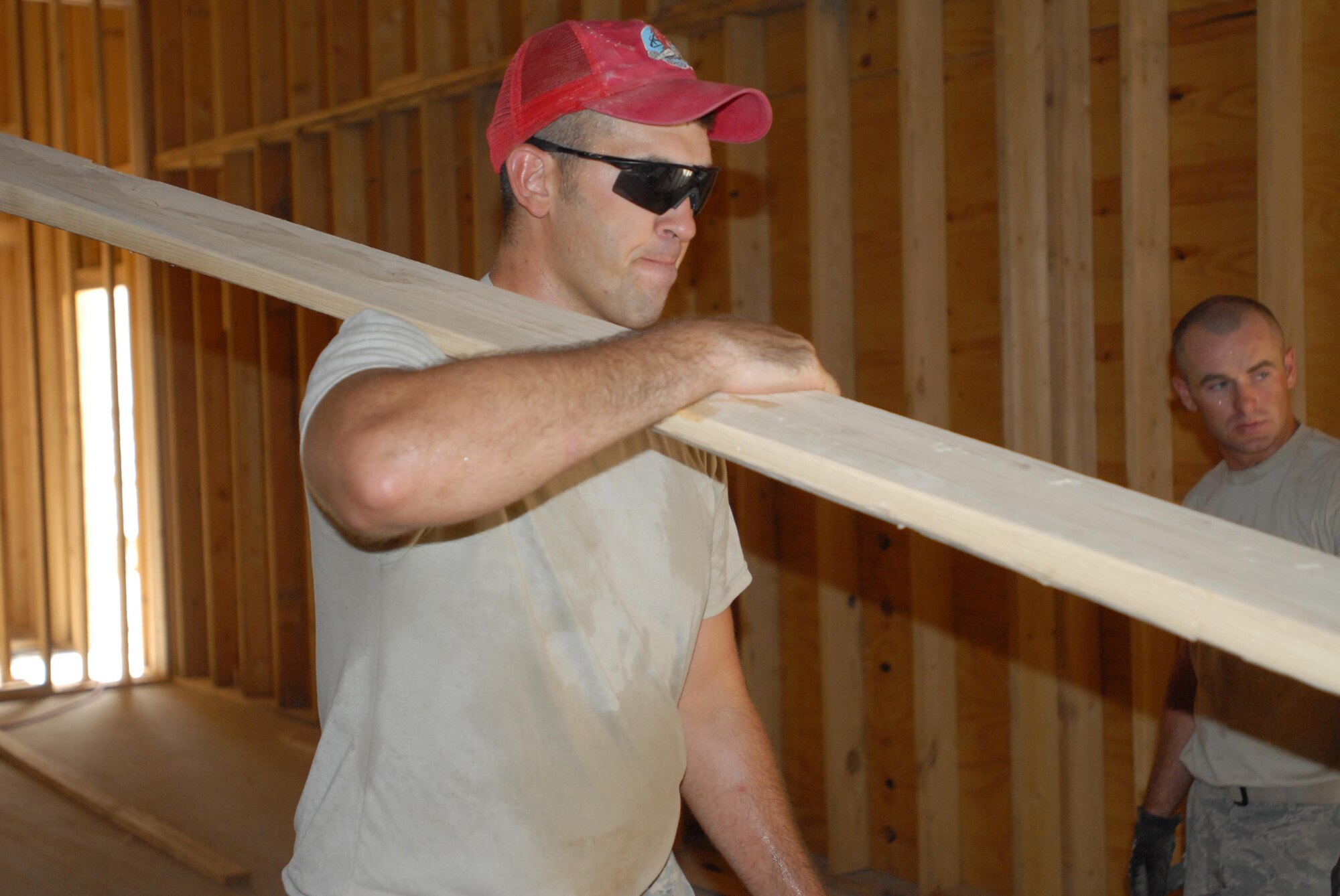 Staff Sgt. Jeffrey Ratliff helps build a new hall for the Red Bull Band in June at Contingency Operating Base Basra, Iraq. Sergeant Ratliff is assigned to the 557th Expeditionary RED HORSE Squadron. (U.S. Army photo/Sgt. Frank Vaughn) 
