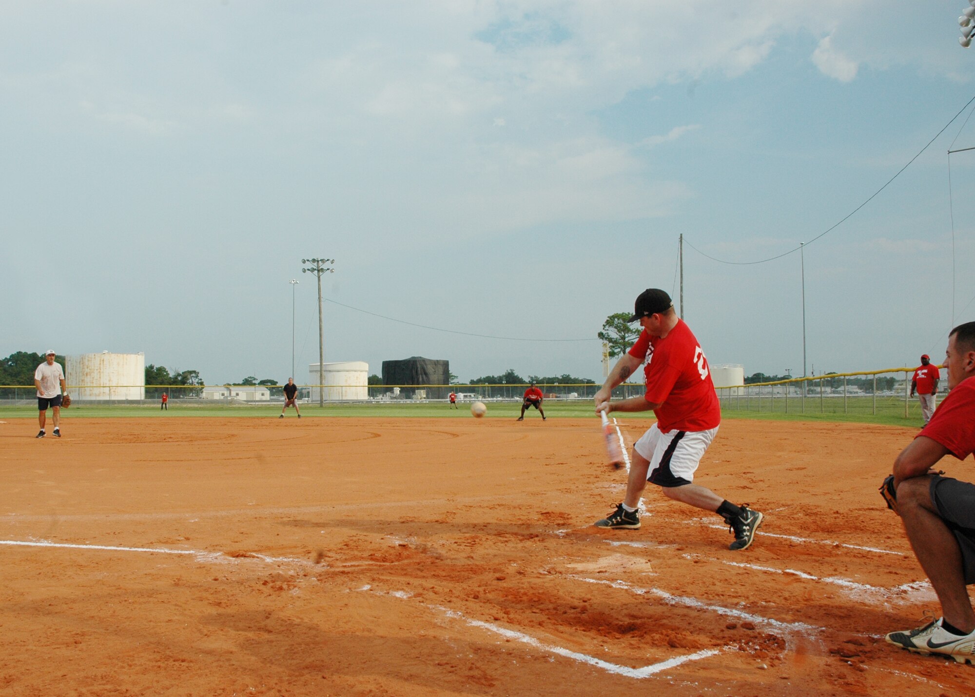 EGLIN AIR FORCE BASE, Fla. -- Staff Sgt. Zachary “Heath” Higgins, 96th Medical Group, swings at a low pitch during the softball intramural playoffs. The MedGroup beat the 96th Communication Squadron "Wire Dawgs" 7-6 and the 46th Aircraft Maintenance Squadron 10-5 July 9 to advance to the next round of the playoffs. They are scheduled to play against the 1st Special Operations Squadron July 13. (U.S. Air Force photo/ Airman Anthony Jennings)
