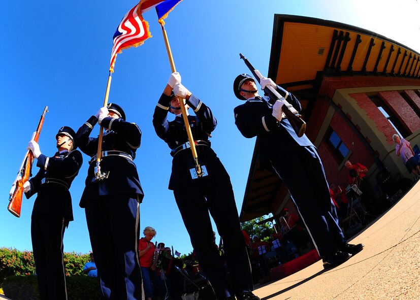 DYESS AIR FORCE BASE, Texas -- The Dyess Air force Base Honor Guard performs July 9 by the old train station in downtown Abilene, Texas, during the Military Salute Art walk. Art Walk is held the second Thursday of each month from 5:30-8 p.m. Activities for families include live performances, movies, art exhibitions and free hands-on activities. (U.S. Air Force Photo by Airman 1st Class Stephen Reyes)