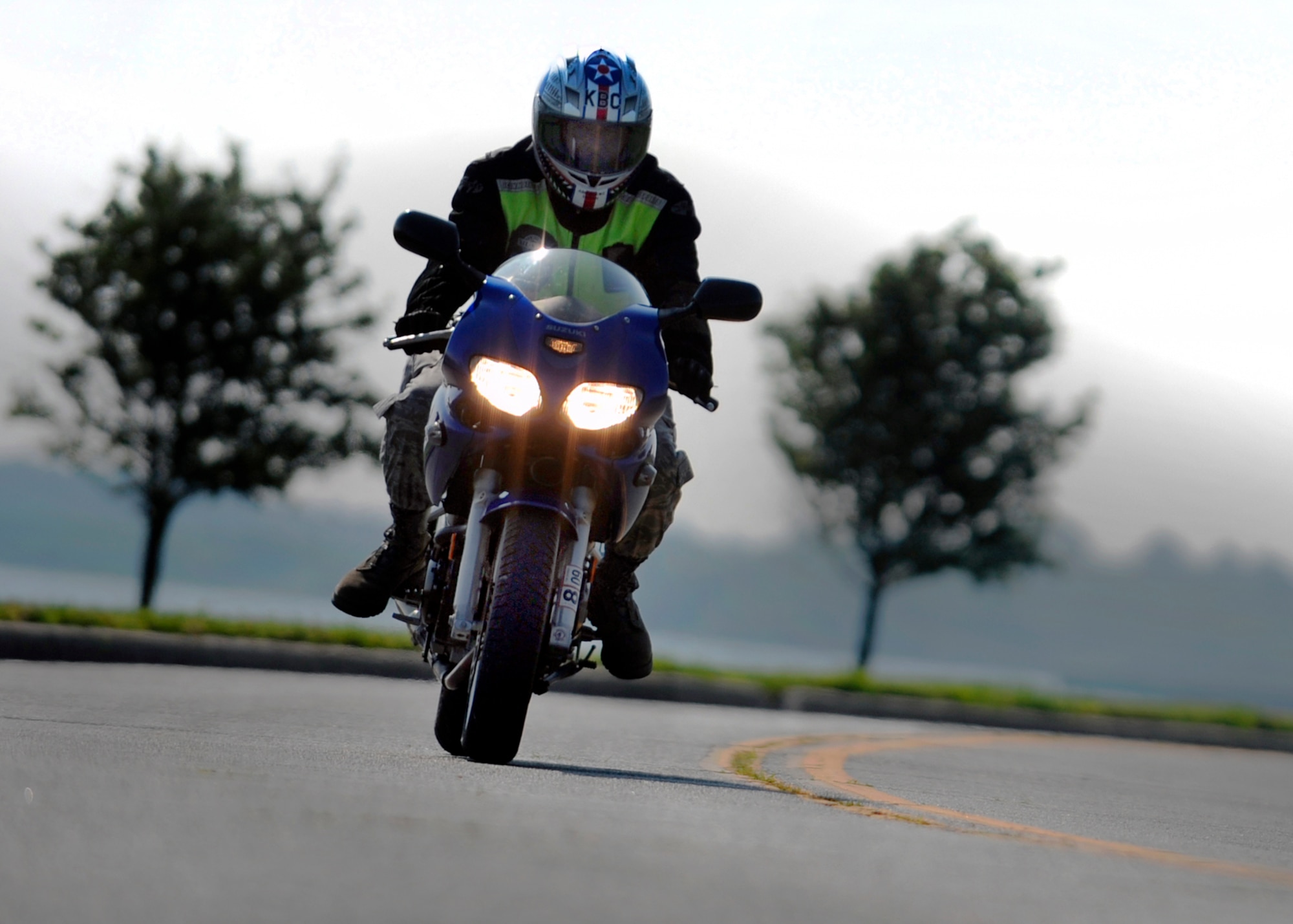 LANGLEY AIR FORCE BASE, Va. – Riding with headlights on at all times helps increase rider visibility.  The 1st Fighter Wing Safety Office reminds riders to adhere to the garment requirements set in AFI 91-207, The U.S. Air Force Traffic Safety Program, which require the wear of protective gear, a brightly colored outer garment during the day and a reflective upper garment during the night.  (U.S. Air Force photo/Senior Airman Vernon Young)