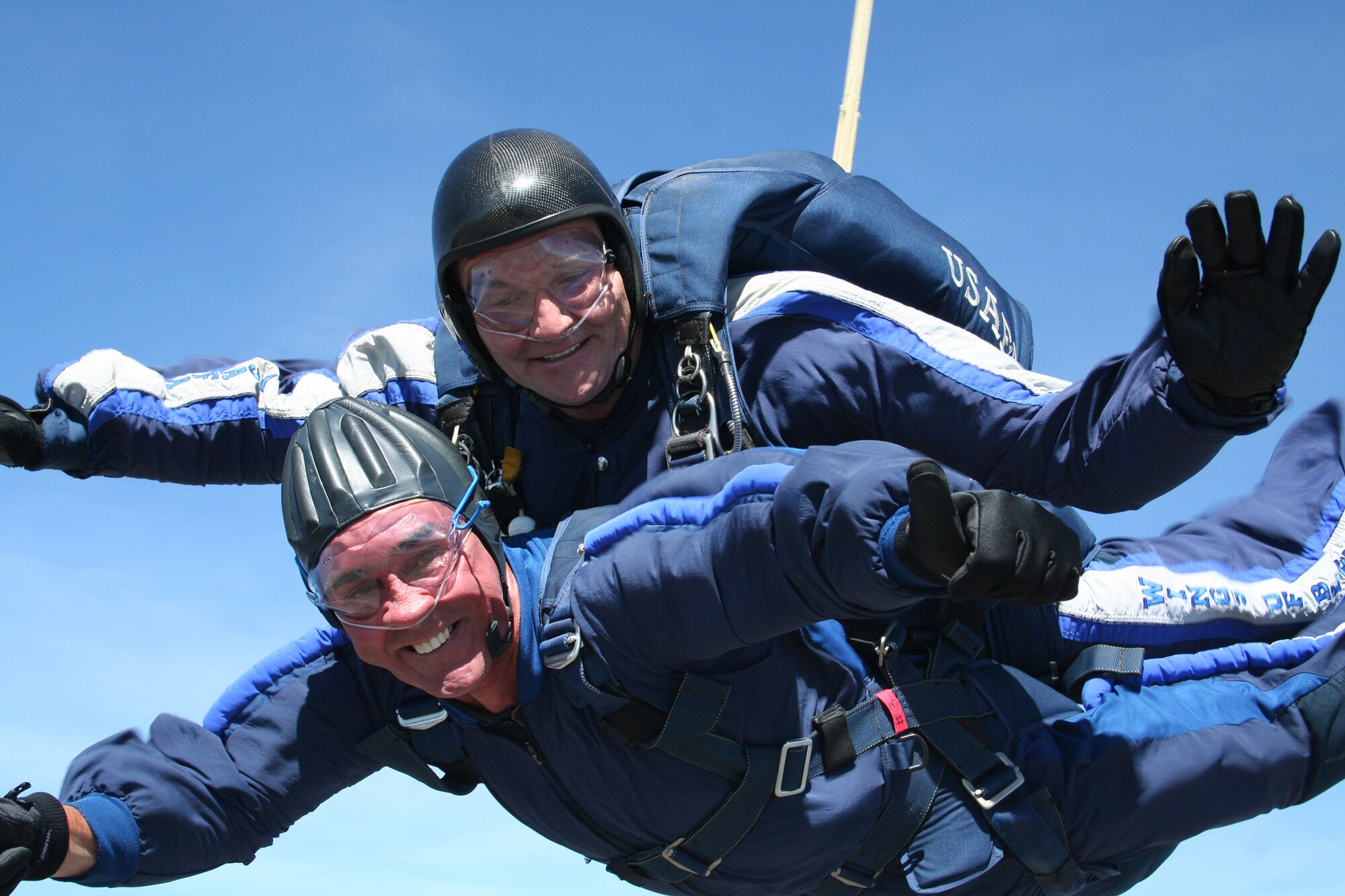 Lt. Col. Aldru Aaron performs a tandem jump with former Denver Broncos coach Mike Shanahan at the U.S. Air Force Academy in Colorado Springs, Colo., May 18. Coach Shanahan led the Broncos to superbowl victories in 1998 and 1999. Colonel Aaron is the 98th Flying Training Squadron commander. (U.S. Air Force photo/Master Sgt. Justus Hanks)