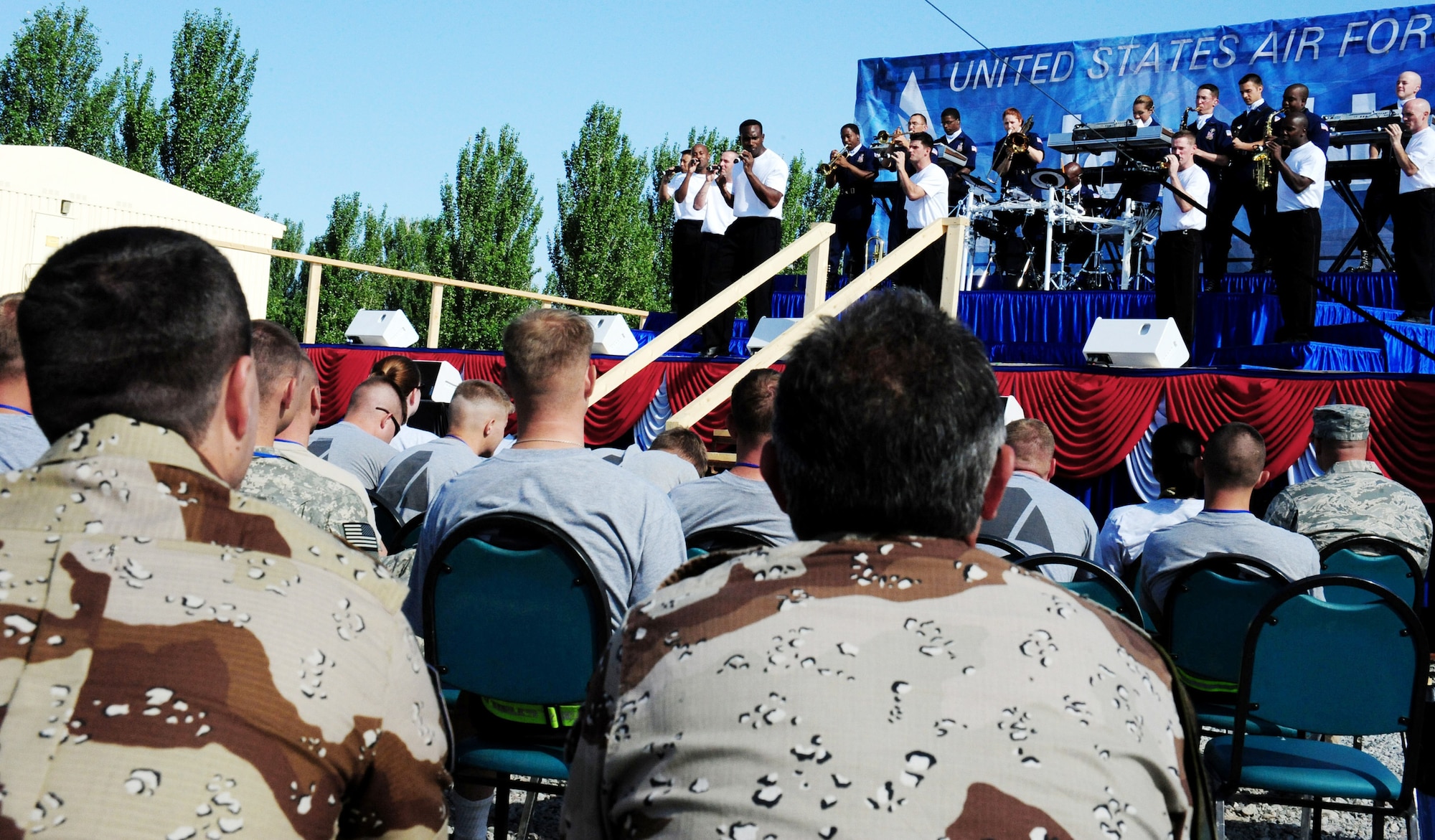 Tops In Blue vocalists perform for U.S. servicemembers and coalition forces during a 90-minute show July 10 at Manas Air Base, Kyrgyzstan. (U.S. Air Force photo/Staff Sgt. Olufemi Owolabi) 