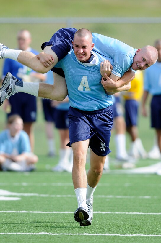 Basic cadet trainees with the U.S. Air Force Academy's Class of 2013 participate in the guerilla relays during Field Day activities here today. About 1,344 trainees competed in various athletic events during Field Day, including tugof war, log relays, steeple chase and sprint relays. Basic cadet training started June 25 and continues through Aug. 1. The new cadets are in their first month of training and are learning about Air Force heritage, honor, discipline and Air Force core values, in addition to improving physicalfitness. The fall academic semester begins Aug. 6. (U.S. Air Force photo/Mike Kaplan)