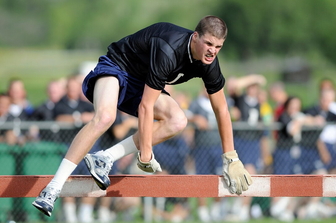 Basic cadet trainees with the U.S. Air Force Academy's Class of 2013 participate in the steeple chase during Field Day activities here today. About 1,344 trainees competed in various athletic events during Field Day, including tugof war, log relays, steeple chase and sprint relays. Basic cadet training started June 25 and continues through Aug. 1. The new cadets are in their first month of training and are learning about Air Force heritage, honor, discipline and Air Force core values, in addition to improving physicalfitness. The fall academic semester begins Aug. 6. (U.S. Air Force photo/Mike Kaplan)