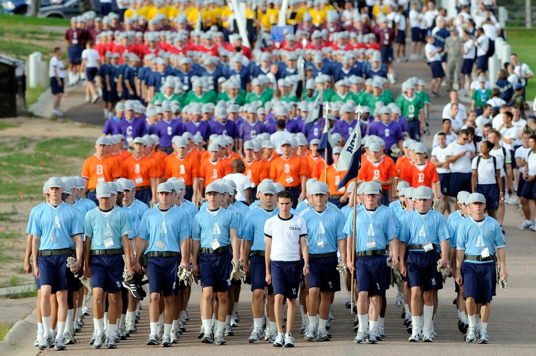 Basic cadet trainees with the U.S. Air Force Academy's Class of 2013 march to the athletic fields during Field Day activities here today. About 1,344 trainees competed in various athletic events during Field Day, including tugof war, log relays, steeple chase and sprint relays. Basic cadet training started June 25 and continues through Aug. 1. The new cadets are in their first month of training and are learning about Air Force heritage, honor, discipline and Air Force core values, in addition to improving physicalfitness. The fall academic semester begins Aug. 6. (U.S. Air Force photo/Mike Kaplan)