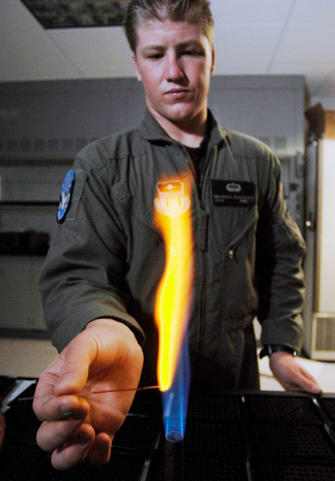 Cadet 1st Class Brandon McCutcheon prepares a sample for an experiment that uses a dye to identify free radicals at the U.S. Air Force Academy in Colorado Springs, Colo., July 10 in hopes of one day treating chemical warfare decontamination and cancer patients. The Academy offers a four-year program of instruction and experience designed to provide cadets the knowledge and character essential for leadership, and the motivation to serve as Air Force career officers. Cadet McCutcheon, a biochemistry major with Cadet Squadron 15, has been selected to attend medical school after graduation. (U.S. Air Force photo/Tech. Sgt. Larry A. Simmons)