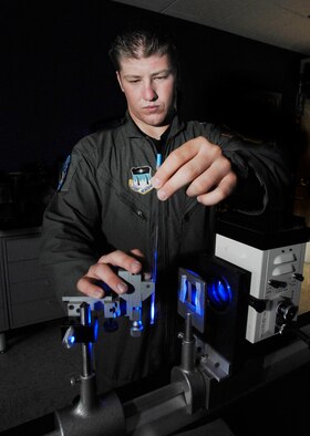 Cadet 1st Class Brandon McCutcheon performs an experiment using a dye to identify free radicals at the U.S. Air Force Academy in Colorado Springs, Colo., July 10 in hopes of one day treating chemical warfare decontamination and cancer patients. The Academy offers a four-year program of instruction and experience designed to provide cadets the knowledge and character essential for leadership, and the motivation to serve as Air Force career officers. Cadet McCutcheon, a biochemistry major with Cadet Squadron 15, has been selected to attend medical school after graduation. (U.S. Air Force photo/Tech. Sgt. Larry A. Simmons)