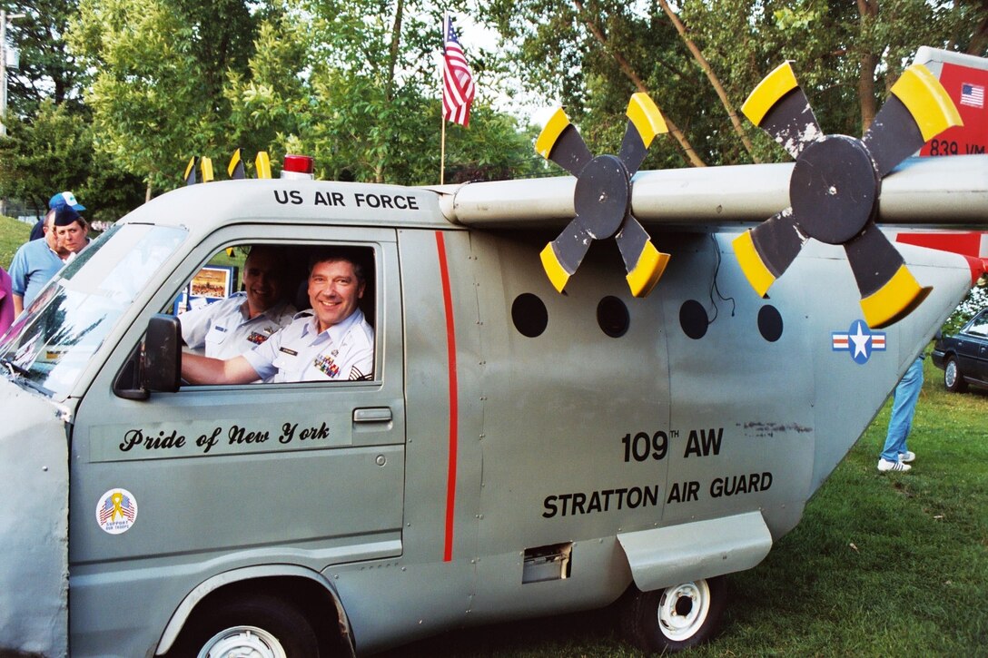 July 14, 2004 - TSgt Scott Dunn (left) and TSgt Ed Stromski (right) prepare for take-off in a 109AW mini-130 prior to a concert in Freedom Park, Scotia, NY.  TSgt Dunn plays trombone and has his private pilot's license.  TSgt Stromski also plays trombone, and is a pilot for US Airways when not performing music.