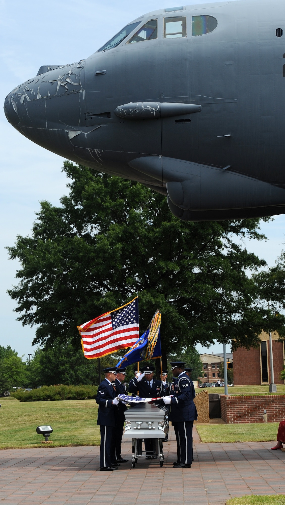 LANGLEY AIR FORCE BASE, Va. --  Members of the Langley Honor Guard begin to fold the flag on top of the casket in a demonstration of a funeral ceremony during their graduation ceremony here July 9.  This was the first flight from Langley to be trained by the Air Force Honor Guard Training Team.  (U.S. photo/Senior Airman Zachary Wolf)


